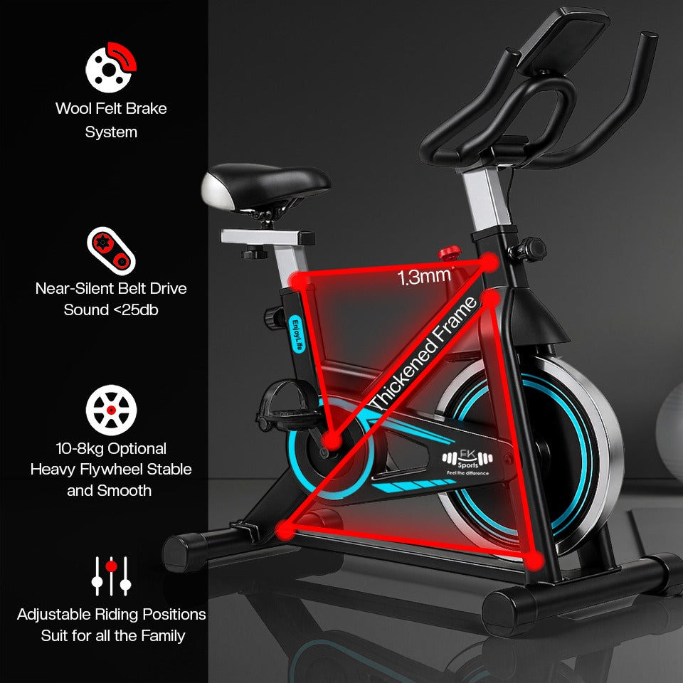 Indoor exercise bike with features highlighted on a dark background