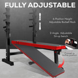 Adjustable gym bench with height and angle adjustment features on a gray background
