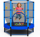 Child playing on a blue kids trampoline with safety net and colorful balls.