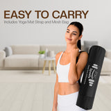 Woman holding a yoga mat with strap and mesh bag in a living room setting
