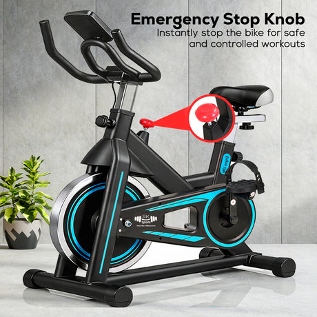Exercise bike with emergency stop knob feature on a gray background