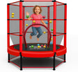 Child playing on a red kid trampoline with safety net and colorful balls.