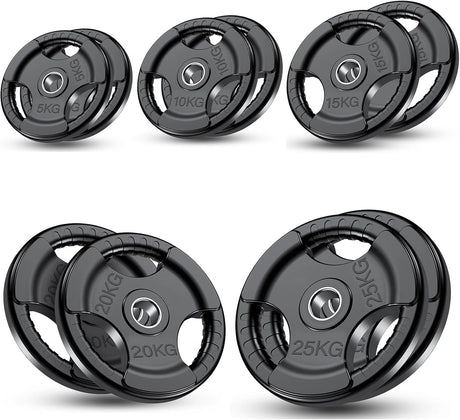 Set of weight plates with varying weights on a white background