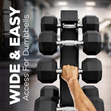 Hand holding a set of dumbbells with dumbbell weight rack and gym equipment in the background, text 'Wide & Easy Access For Dumbbells' on the left.